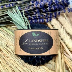 Eine runde„LANDSEIFE – Bio Rasierseife mit Aktivkohle“ für eine entzündungshemmende rasur